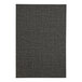 A close-up of a black menu cover with a gray pattern on a fabric.