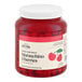 A large plastic jar of Hometown Provisions maraschino cherries with stems.
