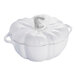 A white Staub enameled cast iron pot with a curved neck and a handle.