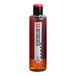 A close up of a SHOTT Butterscotch Flavoring Syrup bottle with a red lid.