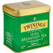 A green and gold Twinings metal box of Irish Breakfast loose leaf tea.