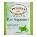 A green and white package of Twinings Pure Peppermint Herbal Tea Bags.