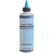 A close-up of a bottle of Chefmaster Royal Blue airbrush food color.