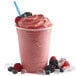 A pink Wildberry Fruit Smoothie with ice cubes and berries.