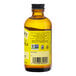 A close up of a Nielsen-Massey Pure Lemon Extract bottle with a yellow label.