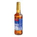 A Torani Chocolate Chip Cookie Dough flavoring syrup bottle with a blue label.