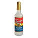 A Torani Almond flavoring syrup bottle with a gold cap.