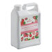 A white Bossen container of strawberry syrup with a label on it.