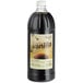 A black bottle of Regal Imitation Vanilla syrup with a white label.