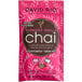 A pink bag of David Rio Flamingo Vanilla Decaf Chai Tea Latte packets with white text and a black circle with white text.
