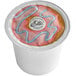 A white container of Ellis Donut Shop Blend coffee single serve cups with a pink and blue logo.