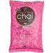 A pink package of David Rio Flamingo Vanilla Decaf Sugar-Free Chai Tea Latte Mix with white text.