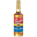 A Torani Vanilla Bean Flavoring Syrup bottle with a label.