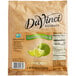 A bottle of DaVinci Gourmet Sweetened Lime Cocktail Mixer with a lime and slice on the label.