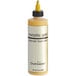 A close up of a Chefmaster Metallic Gold airbrush color bottle with a yellow cap.