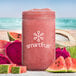 A pink smoothie in a jar made with Smartfruit Wild Watermelon Puree with a slice of watermelon on the rim.