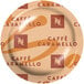 A Nespresso Professional case of 50 Caffe Caramello coffee pods on a table.