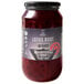 A case of 4 jars of Wild Hibiscus Lotus Root in Hibiscus and Ginger Syrup on a table with a label on the syrup jar.