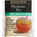 A close up of a Bigelow premium decaffeinated tea bag with yellow and red accents.