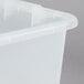 A Vollrath Traex Color-Mate clear plastic drain box.