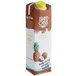 A white carton of Island Oasis Pina Colada Mix with brown and white text and a yellow cap.