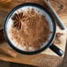 A mug of Oregon Chai spiced chai latte with cinnamon and star anise.