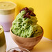 A bowl of green ice cream made with Bossen Matcha Snow Ice Powder.