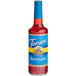 A Torani Sugar-Free Raspberry syrup bottle with a blue label.