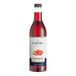 A close up of a Capora Strawberry Flavoring Syrup bottle filled with red liquid.
