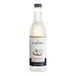 A close up of a bottle of Capora Coconut Flavoring Syrup with a white label.