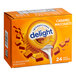 A box of International Delight Caramel Macchiato coffee creamer on a counter.