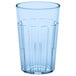 A clear plastic tumbler with a blue rim.