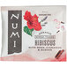 A Numi Organic Hibiscus Tea bag packet on a white background.