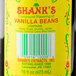 A bottle of Shank's Imitation Vanilla with a yellow label.