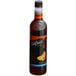 A close up of a bottle of DaVinci Gourmet Sugar Free Amaretto Flavoring Syrup on a white background.
