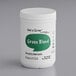 A white Add A Scoop container of green blend supplement powder with a green label on a counter.