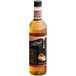 A close up of a DaVinci Gourmet Toasted Hazelnut Flavoring Syrup bottle with a black cap.