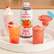 A tray with glasses of pink Smartfruit Summer Strawberry drinks on a table.