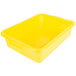 A yellow plastic Vollrath Traex food storage container with a snap-on lid.