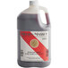 A gallon jug of Nielsen Massey No Sugar Added Pure Vanilla Extract with a red and white label.