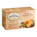 A box of Twinings Orange & Cinnamon Spice herbal tea bags with oranges and cinnamon on the front.