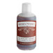 A bottle of Nielsen Massey No Sugar Added Pure Vanilla Extract on a counter.
