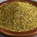 A bowl of yellow Regal Tangy Lemon Pepper seasoning.