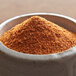 A bowl of Regal Cajun spice, a ground red spice.