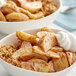 A bowl of potato wedges with Regal Apple Pie Spice on a white surface.