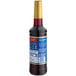 A Torani Blackberry flavoring syrup bottle with a blue label and gold cap.