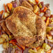 A plate of a whole chicken with vegetables seasoned with Regal Canadian Chicken Seasoning.