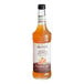 A case of 6 Monin Zero Calorie Natural Pumpkin Spice Flavoring Syrup bottles with orange liquid and white labels.