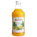 A Monin bottle of orange liquid.