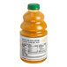 A bottle of Dr. Smoothie 100% Crushed Mango Fruit Smoothie Mix with orange liquid in it.